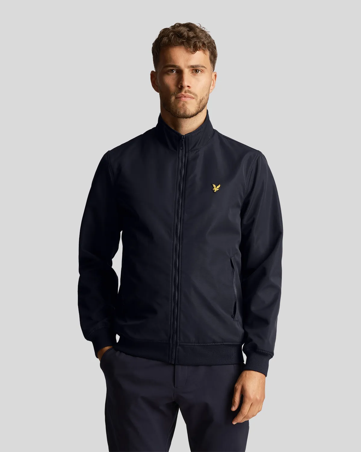Bomber blu in softshell con logo aquila gialla ricamata sul petto