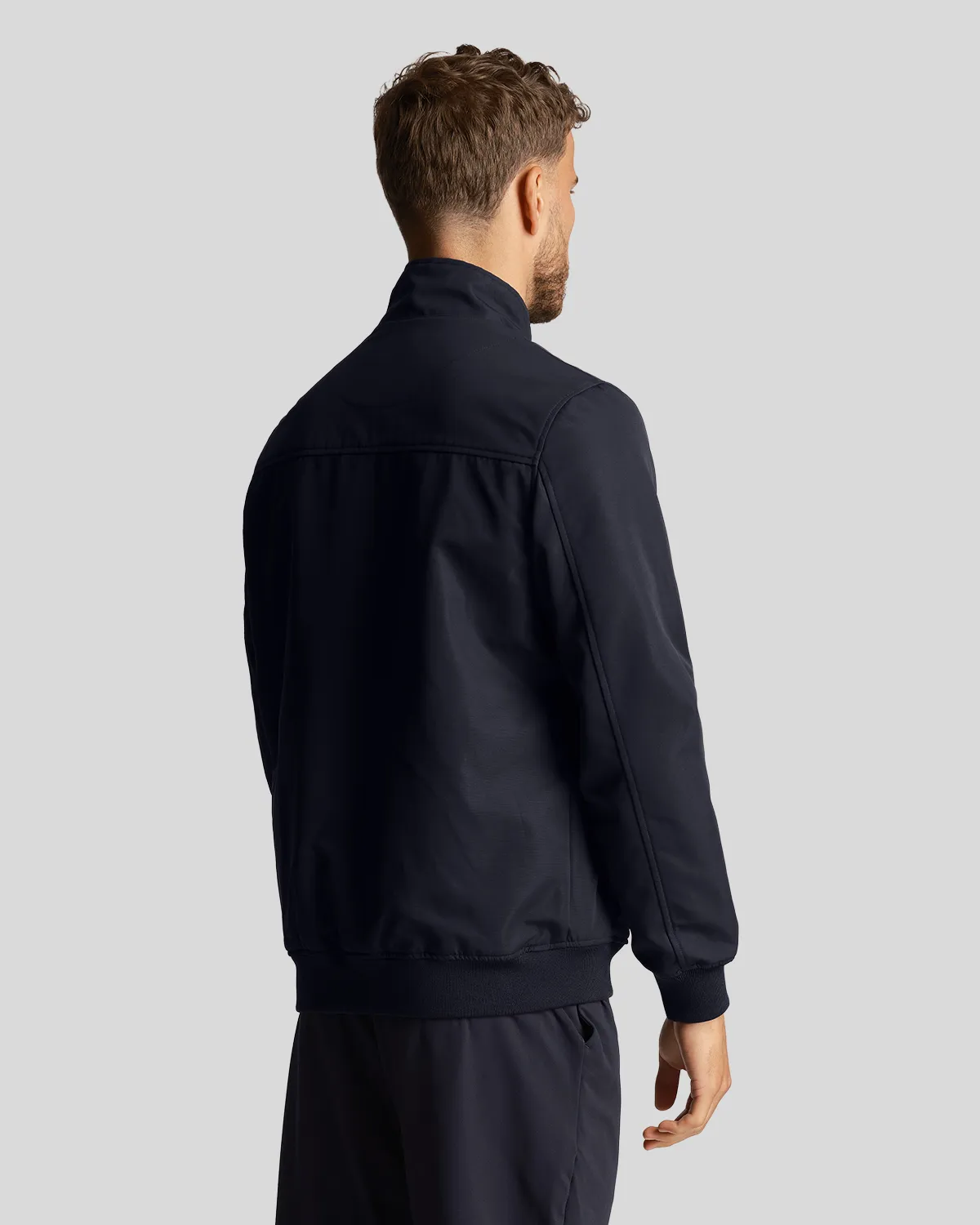 Bomber blu in softshell con logo aquila gialla ricamata sul petto