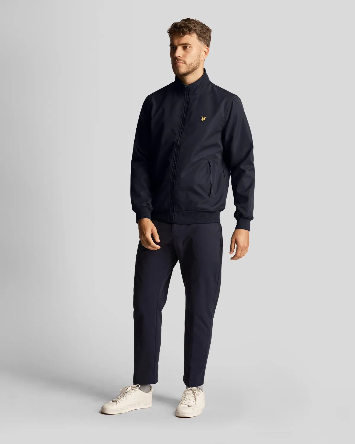 Bomber blu in softshell con logo aquila gialla ricamata sul petto