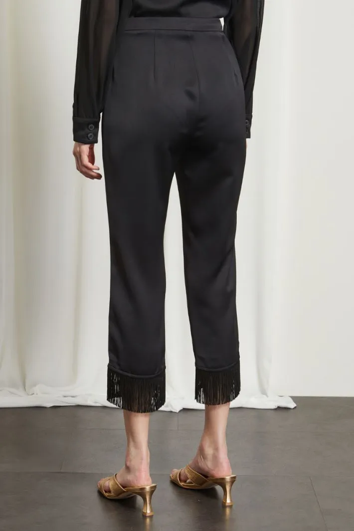 Pantaloni con frange al fondo
