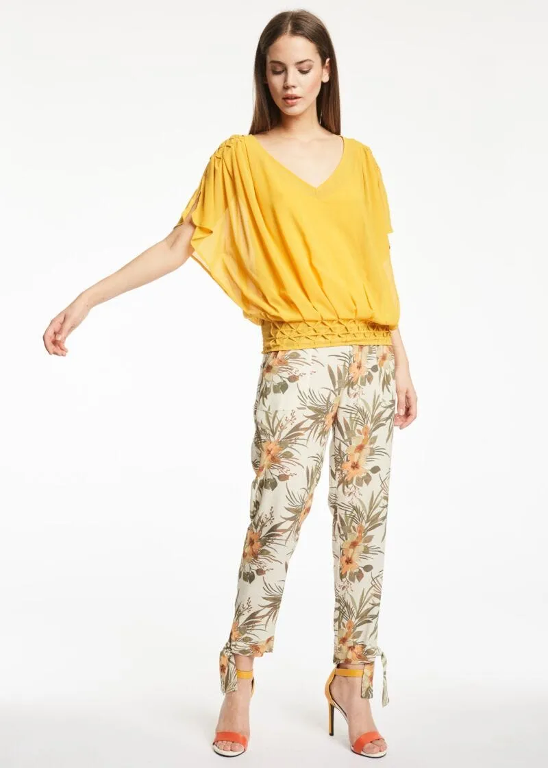 Pantaloni con motivo tropicale