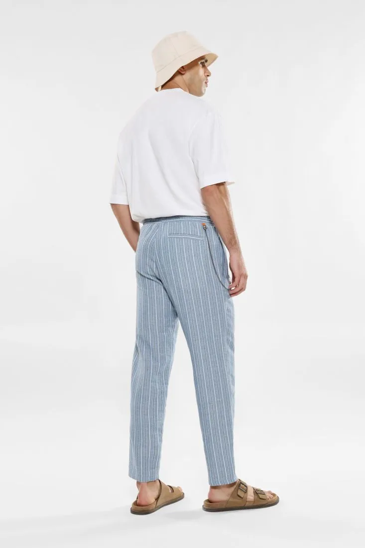 Pantaloni slim-fit fantasia rigata con coulisse e catena